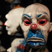 The clown mask worn by actor Heath Ledger in the 2008 film The Dark Knight is on display at the DC Comics Exhibition. (Photo by Jack Taylor/Getty Images)