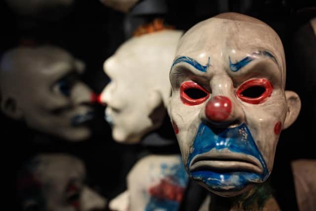 The clown mask worn by actor Heath Ledger in the 2008 film The Dark Knight is on display at the DC Comics Exhibition. (Photo by Jack Taylor/Getty Images)