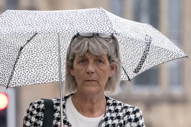 Jane Midgley, mother of victim Simon Midgley, arrives for the fatal accident inquiry (FAI) into the deaths of two men, Simon Midgley, 32, and his partner Richard Dyson, 38, from London, in the Cameron House fire, at Paisley Sheriff Court. Issue date: Monday August 15, 2022. PA Photo. The inquiry, will look at issues around guest and fire safety at the hotel on the banks of Loch Lomond following the fatal fire in December 2017. See PA story INQUIRY Hotel Photo credit should read: Jane Barlow/PA Wire