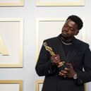 Daniel Kaluuya poses backstage with the Oscar for Best Actor in a Supporting Role, for Judas And The Black Messiah, at the 93rd Academy Awards ceremony.