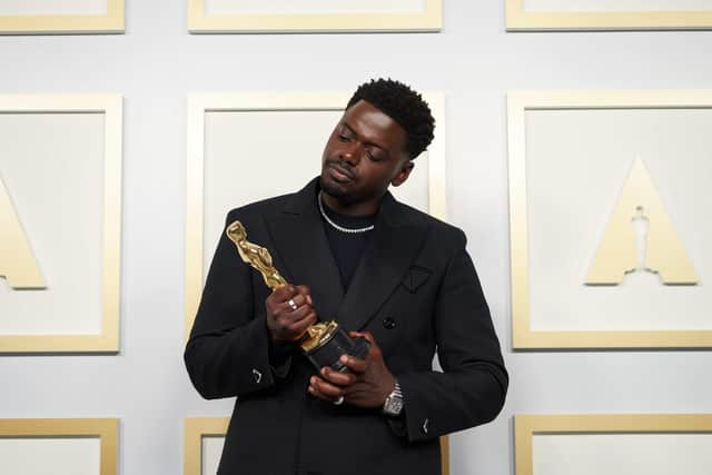 Daniel Kaluuya poses backstage with the Oscar for Best Actor in a Supporting Role, for Judas And The Black Messiah, at the 93rd Academy Awards ceremony.