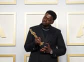 Daniel Kaluuya poses backstage with the Oscar for Best Actor in a Supporting Role, for Judas And The Black Messiah, at the 93rd Academy Awards ceremony.