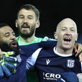 Dundee midfield lynchpin Charlie Adam (r) celebrates with team mates after the Scottish Premiership Playoff Final 2nd Leg between Kilmarnock and Dundee at Rugby Park on May 24, 2021 in Kilmarnock, Scotland. (Photo by Ian MacNicol/Getty Images)
