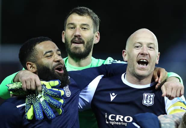 Dundee midfield lynchpin Charlie Adam (r) celebrates with team mates after the Scottish Premiership Playoff Final 2nd Leg between Kilmarnock and Dundee at Rugby Park on May 24, 2021 in Kilmarnock, Scotland. (Photo by Ian MacNicol/Getty Images)