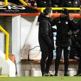 Aberdeen assistant Henry Apaloo (L) and manager Stephen Glass remonstrate to the fourth official after Jota's goal makes it 3-2.