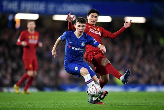 Billy Gilmour escapes the clutches of Liverpool's Takumi Minamino. The Chelsea teenager won the man of the match award and was hailed by boss Frank Lampard