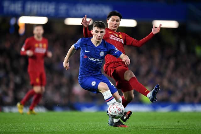 Billy Gilmour escapes the clutches of Liverpool's Takumi Minamino. The Chelsea teenager won the man of the match award and was hailed by boss Frank Lampard