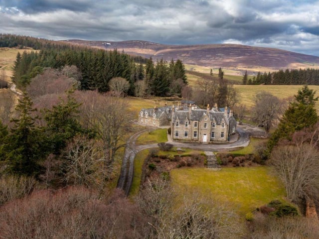 The house is nestled in seven acres of land with lawns, herbaceous borders, mature trees and shrubs.
