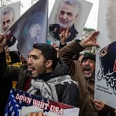 Protesters hold posters of Iranian Revolutionary Guard Major General Qassem Soleimani outside the US Consulate in Istanbul after he was killed by a drone strike (Picture: Chris McGrath/Getty Images)