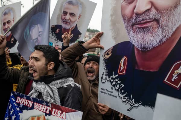 Protesters hold posters of Iranian Revolutionary Guard Major General Qassem Soleimani outside the US Consulate in Istanbul after he was killed by a drone strike (Picture: Chris McGrath/Getty Images)