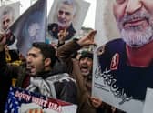 Protesters hold posters of Iranian Revolutionary Guard Major General Qassem Soleimani outside the US Consulate in Istanbul after he was killed by a drone strike (Picture: Chris McGrath/Getty Images)