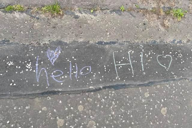 A cheery greeting on an Edinburgh street.