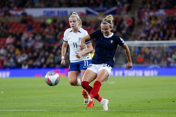 England's Lauren Hemp (left) and Scotland's Martha Thomas battle for the ball during Friday's match in Sunderland.