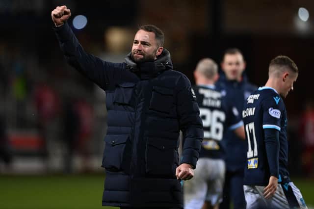 Manager James McPake salutes the Dundee fans after defeating St Johnstone on Wednesday.