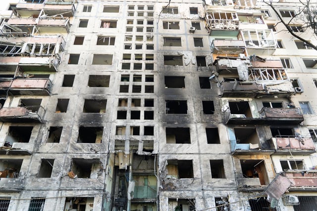 The remnants of an apartment block after it was set on fire by pieces of a Russian missile intercepted by Ukrainian air defences over Kyiv's Obolon district.
Photojournalist Bennett Murray