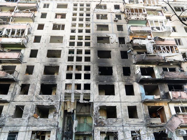 The remnants of an apartment block after it was set on fire by pieces of a Russian missile intercepted by Ukrainian air defences over Kyiv's Obolon district. 
Photojournalist Bennett Murray