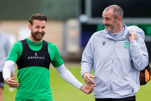 Hibs winger Martin Boyle and assistant manager John Potter enjoy a laugh at training. Photo by Ross Parker/SNS Group