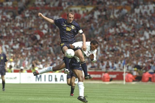 Gary McAllister challenges England's Paul Ince for the ball during Euro 96