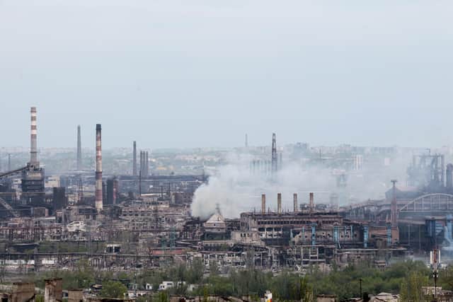 Smoke rises from the Metallurgical Combine Azovstal in Mariupol, in territory under the government of the Donetsk People's Republic, eastern in Mariupol, Ukraine, Thursday, May 5, 2022.  (AP Photo)