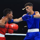 Scotland's Reese Lynch (right) lands a punch on Timon Aaree of Kiribati during his light welterweight round of 32 victory on the opening day of the Birmingham 2022 Commonwealth Games. (Photo by Alex Pantling/Getty Images)