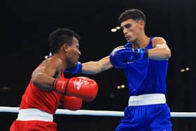 Scotland's Reese Lynch (right) lands a punch on Timon Aaree of Kiribati during his light welterweight round of 32 victory on the opening day of the Birmingham 2022 Commonwealth Games. (Photo by Alex Pantling/Getty Images)