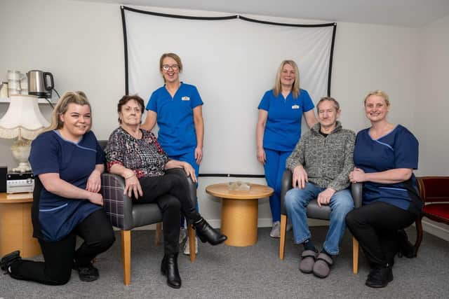 Service users Meg Stuart and Tam Mitchell with staff.