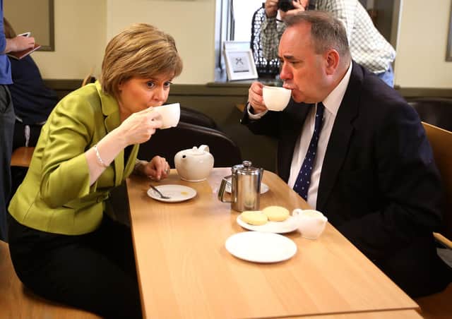 Current First Minister Nicola Sturgeon enjoys a cup of tea with her predecessor Alex Salmond while on the general election campaign trail in 2015