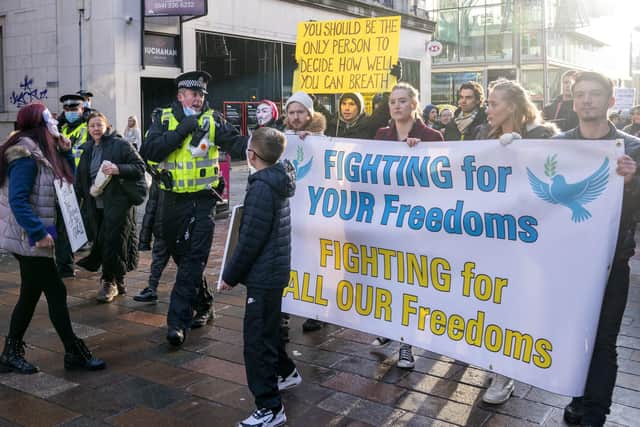 People take part in the "Freedom Rally" an anti-vaccine demonstration organised by the campaign group 'Scotland Against Lockdown' in Glasgow city centre. (Picture credit: Jane Barlow/PA Wire)
