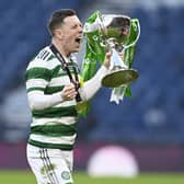 Callum McGregor celebrates another piece of silverware with Celtic.