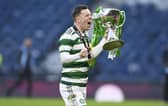 Callum McGregor celebrates another piece of silverware with Celtic.