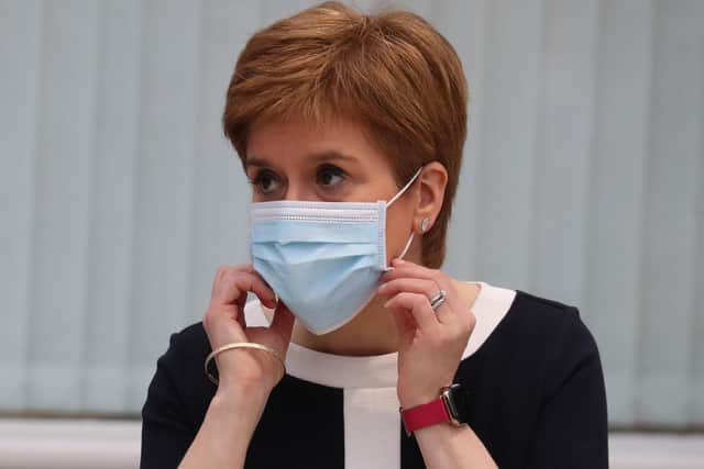 Scotland's First Minister Nicola Sturgeon wears a face mask during her visit to the field hospital the NHS Louisa Jordan. Picture: Andrew Milligan/POOL/AFP via Getty Images