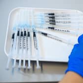 A doctor prepares syringes that contain the Pfizer/BioNTech vaccine against Covid-19. Picture: Jens Schlueter/Getty Images