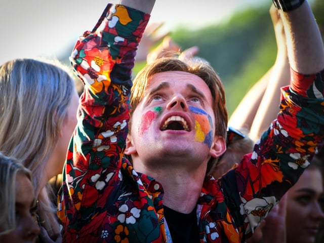 Festival-goers dance and cheer during the TRNSMT Festival on Glasgow Green (Photo by ANDY BUCHANAN / AFP)