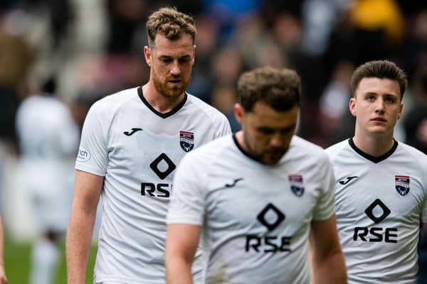 Ross County players look dejected after the 6-1 defeat to Hearts on Saturday that has left them in peril of relegation (Photo by Mark Scates / SNS Group)