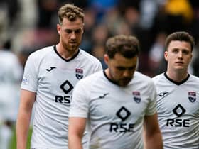 Ross County players look dejected after the 6-1 defeat to Hearts on Saturday that has left them in peril of relegation (Photo by Mark Scates / SNS Group)
