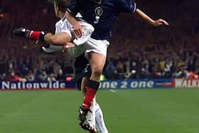 Davidson beats David Beckham to a a high ball playing for Scotland against England in 1999 - and according to his managed "eliminated" Becks in the Euros playoff.