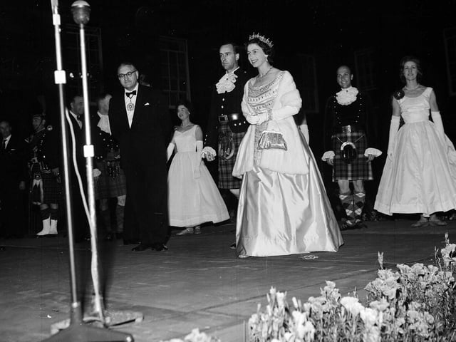Queen Elizabeth and Prince Philip Duke of Edinburgh at the 'Sunset ceremony' at the Palace of Holyroodhouse during their tour of Scotland in July 1962.