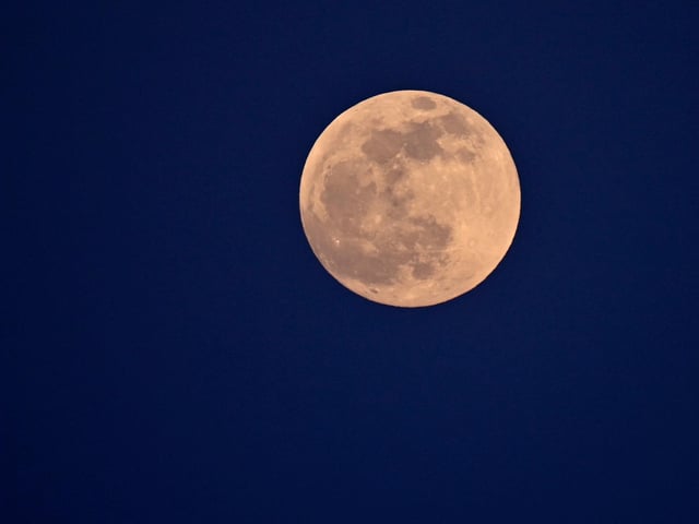 The full moon is pictured on May 15, 2022 from Cagliari, Sardinia (Photo by ALBERTO PIZZOLI/AFP via Getty Images)