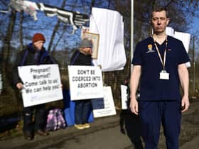 22/02/2023. Glasgow. Queen Elizabeth Hospital. 

Dr Greg Irwin, in front of the vigil.

40 Days For Life start "Lent Vigil" Outside Queen Elizabeth Hospital in Glasgow

Patients face 40 days and nights "prayer vigil" outside a Glasgow hospital as anti abortion group arrive for the duration of Lent.

40 Days For Life, potentially face a buffer zone ban around hospitals and clinics if a bill is passed in the Scottish parliament.

Pro-choice campaigners have hit out against the â€œintimidationâ€ and â€œharassmentâ€ women seeking to access abortions in Glasgow are set to face over the next month.

Today, Wednesday, a consultant paediatric radiologist urged the anti-abortion protesters to move along from the hospital.

Dr Greg Irwin, who has been a vocal advocate for buffer zones, said: â€œWe have got protesters outside the hospital for the next 40 days, all through Lent, 12 hours a day, causing harassment and intimidation of women seeking abortion healthcare.

"It is an incredibly unkind, unfriendly thing to be doing.

The doctor stated that the group can have a â€œprayer vigil anywhere they likeâ€ but criticised the group for staging the campaign as the â€œgates of the hospitalâ€.