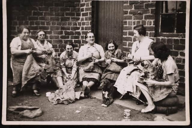 Eupheme Sutherland and friends making sandbags on the second day of the war.