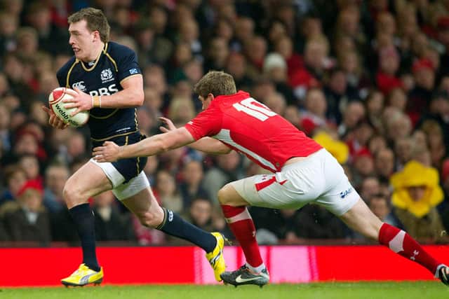 Scotland's Stuart Hogg (left) is chased by Rhys Priestland on his Scotland debut in 2012.