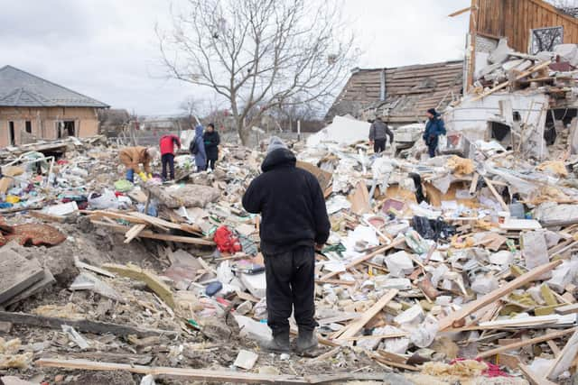 Ihor Mazhayev, 54, searches the ruins of his house, where his wife and 21-year-old daughter were killed by a Russian air strike (Picture: Anastasia Vlasova/Getty Images)