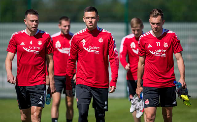 Andy Considine, Christian Ramirez and Ryan Hedges during an Aberdeen training session at Cormack Park.