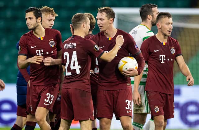 Lukas Julis with the matchball as he's congratulated by his team-mates following his hat-trick against Celtic. Picture: SNS