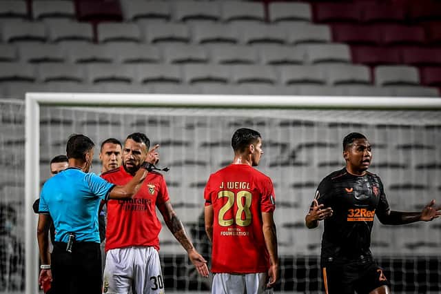 Benfica defender Nicolas Otamendi talks with  referee Jesus Gil Manzano after receiving a red card during the UEFA Europa League group D  match between SL Benfica and Glasgow Rangers (Photo by PATRICIA DE MELO MOREIRA/AFP via Getty Images)