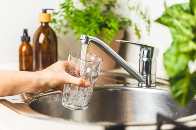 Tap water being poured in a kitchen. Picture: Getty Images