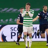 Celtic's Ryan Christie reacts as Ross County's Alex Lacovitti (R) celebrates making it 2-0 . (Photo by Alan Harvey / SNS Group)