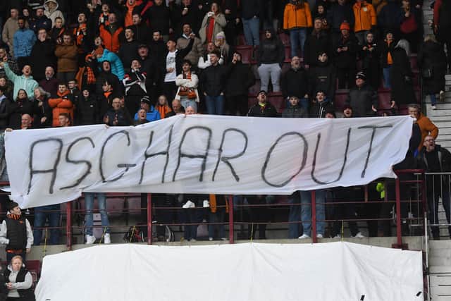 Dundee United fans express their displeasure towards Tony Asghar, the club's sporting director. (Photo by Craig Foy / SNS Group)