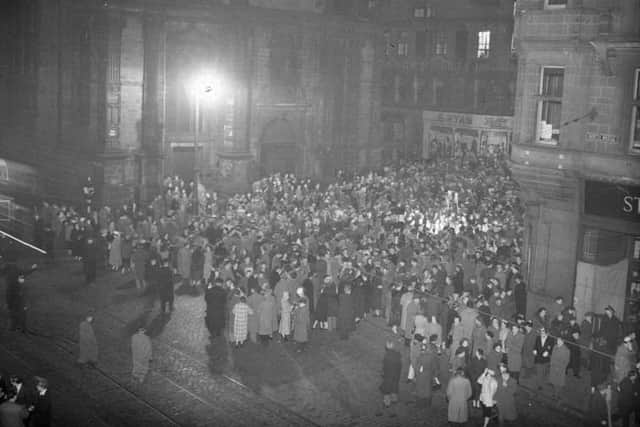 Hogmanay celebrations outside the Tron Kirk on Edinburgh’s Royal Mile in 1955.