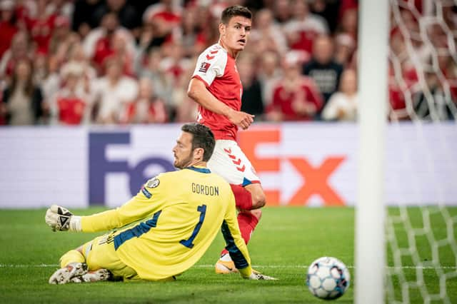 Denmark's Joakim Mahle slips the ball past Craig Gordon to put his sid 2-0 up. (Photo by MADS CLAUS RASMUSSEN/Ritzau Scanpix/AFP via Getty Images)